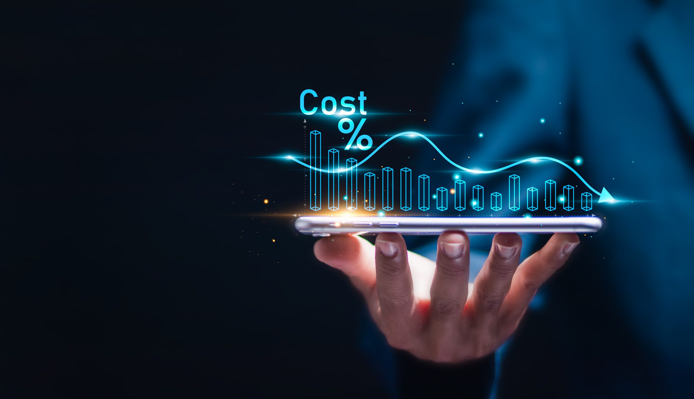 Hand holding a tablet displaying digital cost percentage and financial graphs.